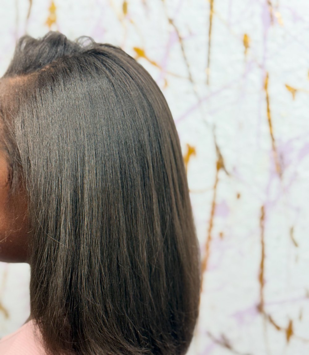 Kids silk press: straight, shoulder-length hair with movement at the ends
