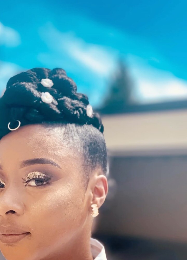 Updo with braid: natural hair styled up with a braid and small hair accents